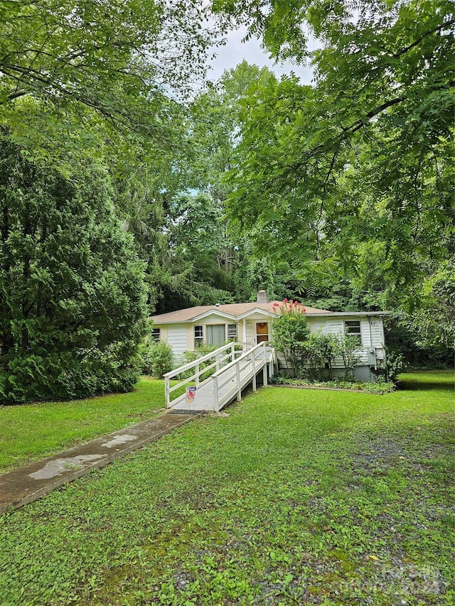 exterior space with a front yard