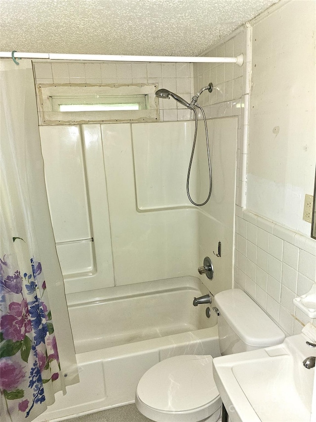 bathroom featuring tile walls, toilet, and shower / bathtub combination with curtain