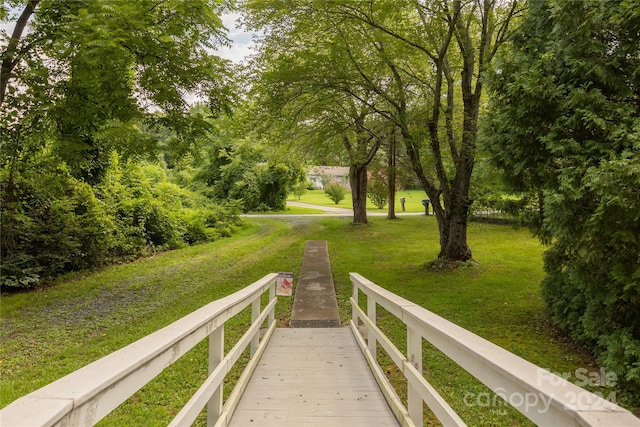 view of home's community featuring a lawn