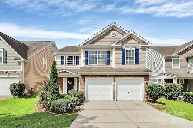 view of front of property with brick siding, concrete driveway, a garage, and a front yard