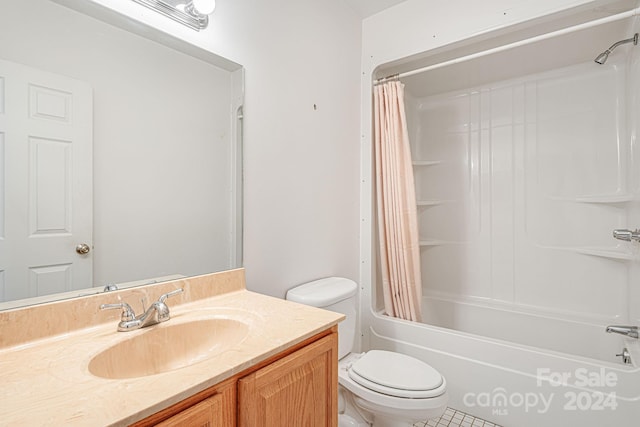 bathroom with tile patterned floors, vanity, and toilet