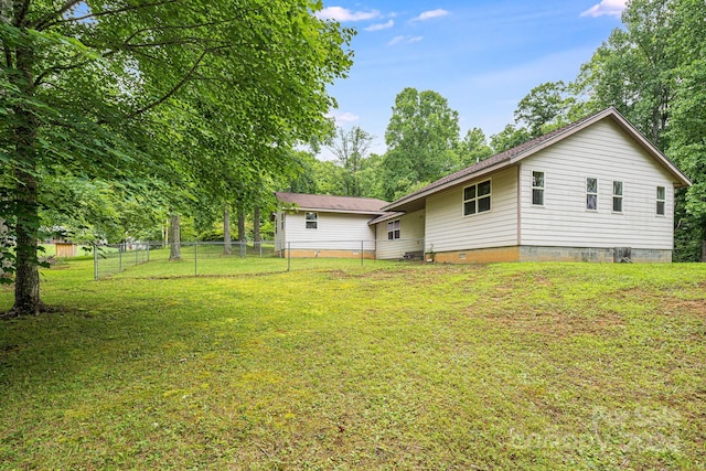 back of house with a yard