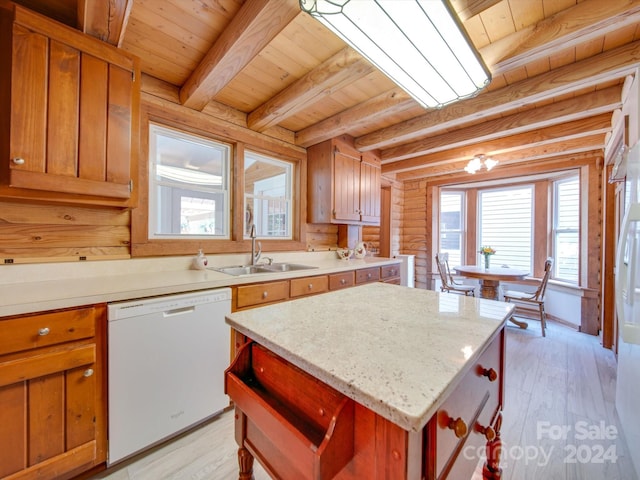 kitchen featuring a kitchen island, sink, white dishwasher, and light hardwood / wood-style floors