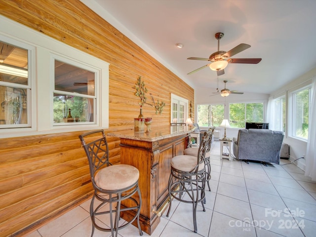 interior space with vaulted ceiling and bar