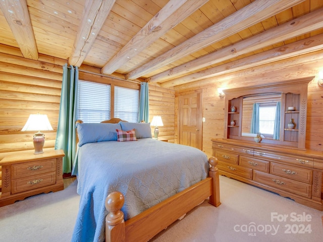 bedroom with beamed ceiling, wood ceiling, and light carpet