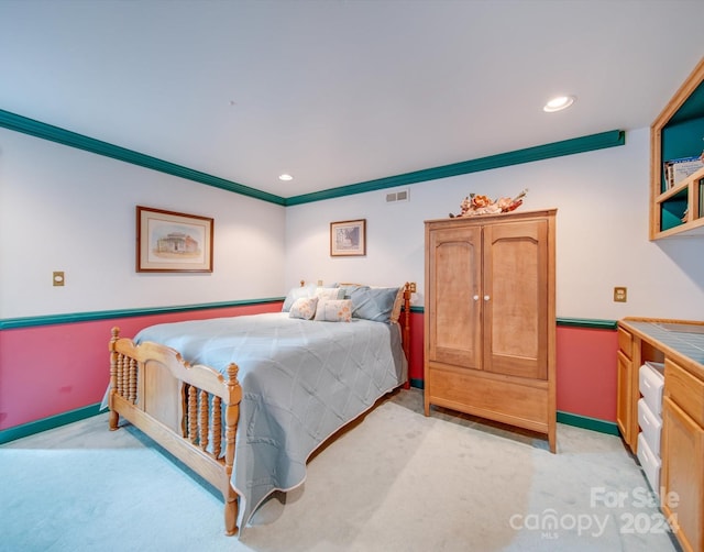 carpeted bedroom with crown molding