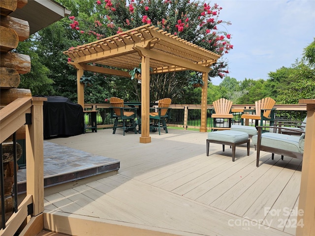 wooden terrace featuring a grill and a pergola