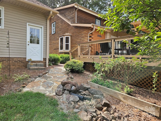 rear view of property with a deck