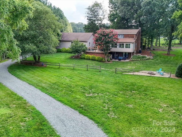 view of yard featuring a wooden deck