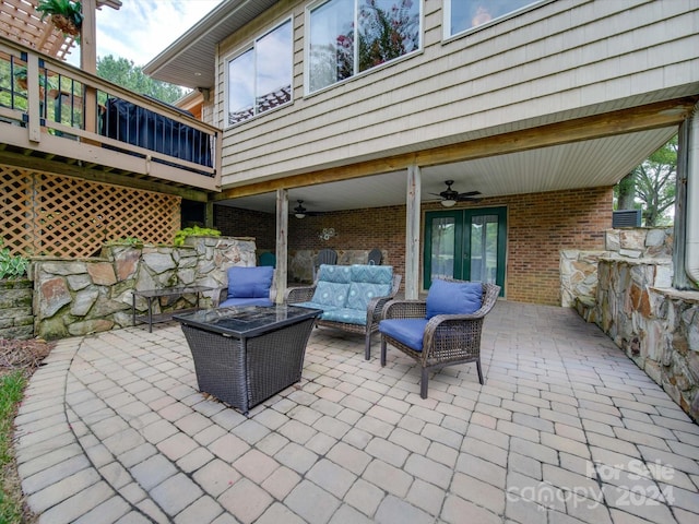 view of patio with an outdoor living space, french doors, and ceiling fan