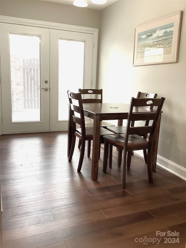 dining room featuring dark hardwood / wood-style floors and french doors