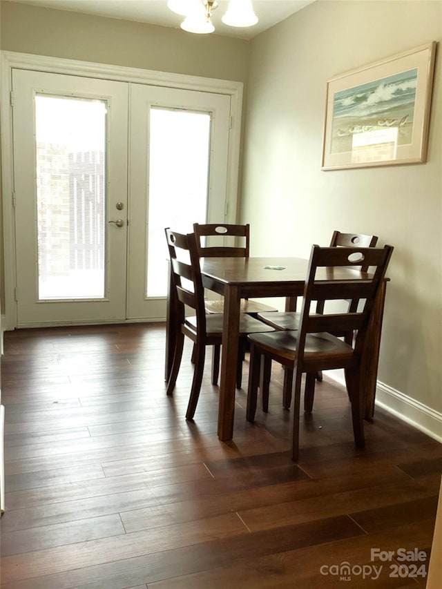 dining room with a healthy amount of sunlight and hardwood / wood-style floors