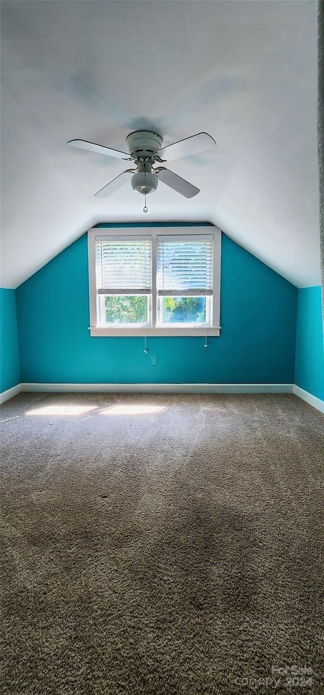 bonus room with ceiling fan, carpet, and vaulted ceiling