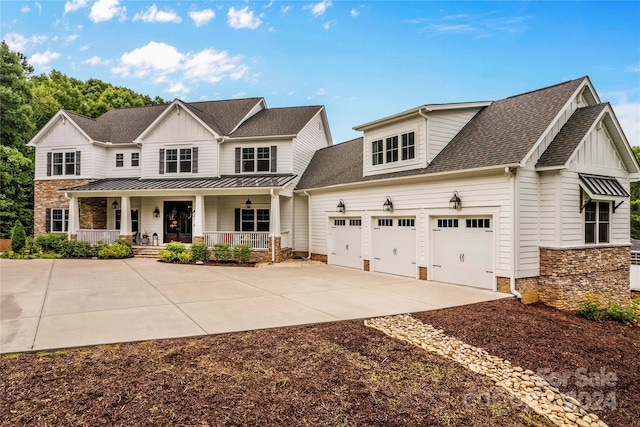 view of front of home with a garage and covered porch