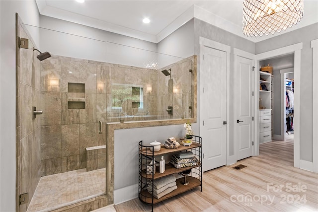 bathroom featuring walk in shower and hardwood / wood-style flooring