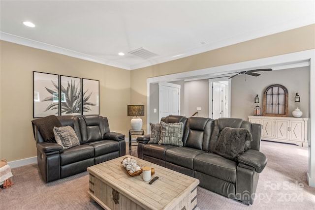 living room featuring crown molding, ceiling fan, and light colored carpet