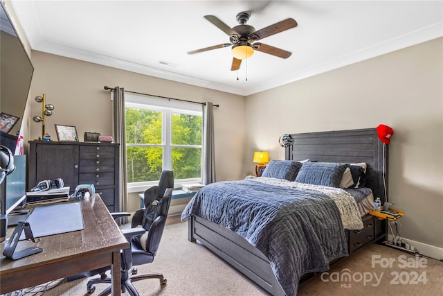 bedroom with light carpet, ceiling fan, and crown molding