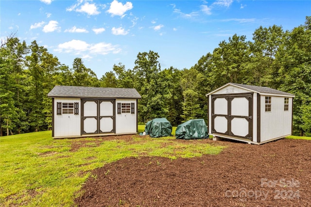 view of outdoor structure with a lawn