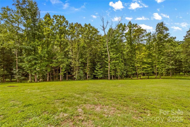 127 Tradition Ln, Mooresville, NC 28115 - view of yard with a wooded view