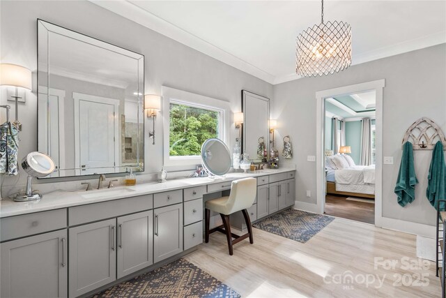 127 Tradition Ln, Mooresville, NC 28115 - full bathroom with vanity, ornamental molding, an inviting chandelier, wood finished floors, and ensuite bathroom