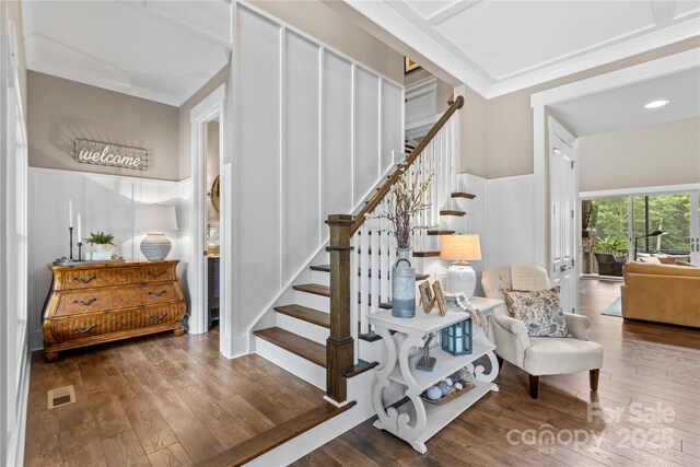 127 Tradition Ln, Mooresville, NC 28115 - stairway featuring visible vents, a decorative wall, and hardwood / wood-style flooring