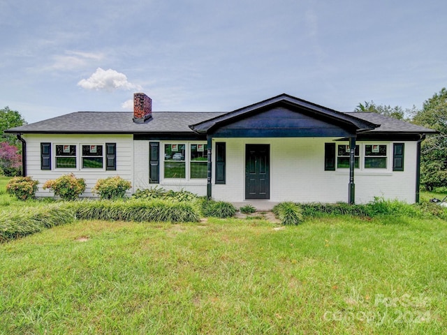 ranch-style house with a front yard