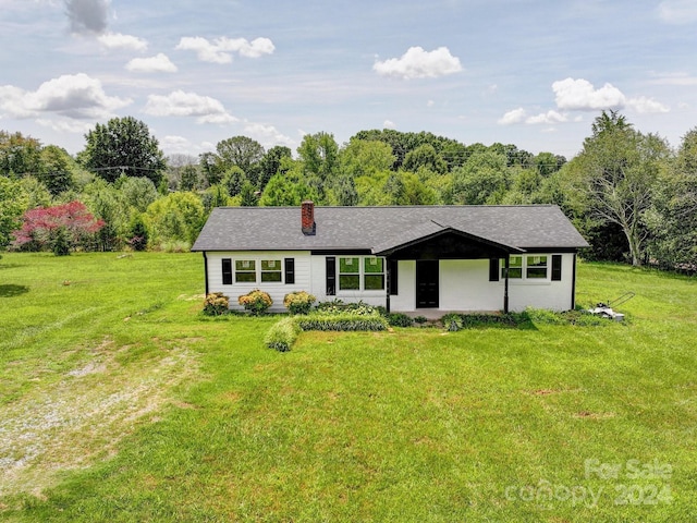 single story home with a front yard