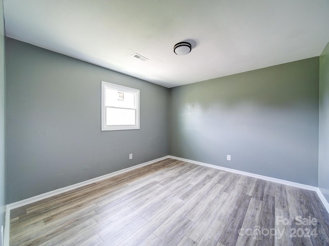 spare room with light wood-type flooring