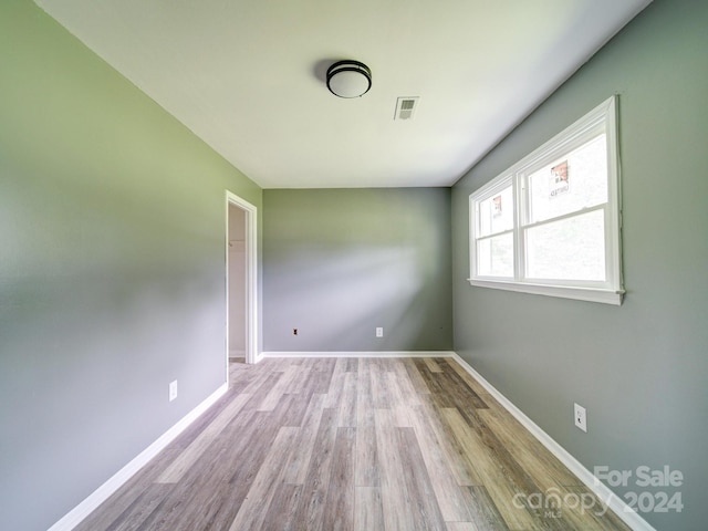 empty room with light wood-type flooring