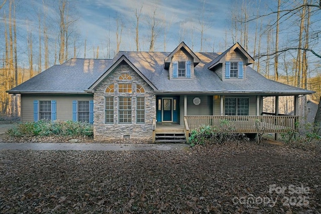 view of front of home with covered porch and stone siding