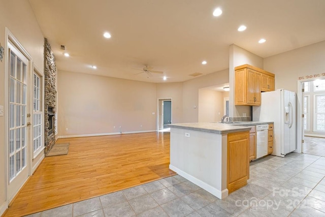 kitchen with white appliances, ceiling fan, light wood-type flooring, light brown cabinets, and recessed lighting