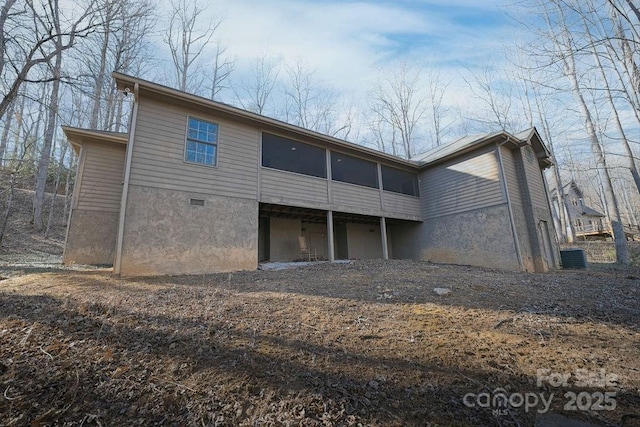 back of property featuring a sunroom