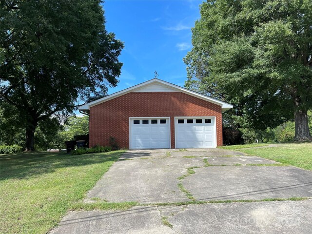 garage with a lawn