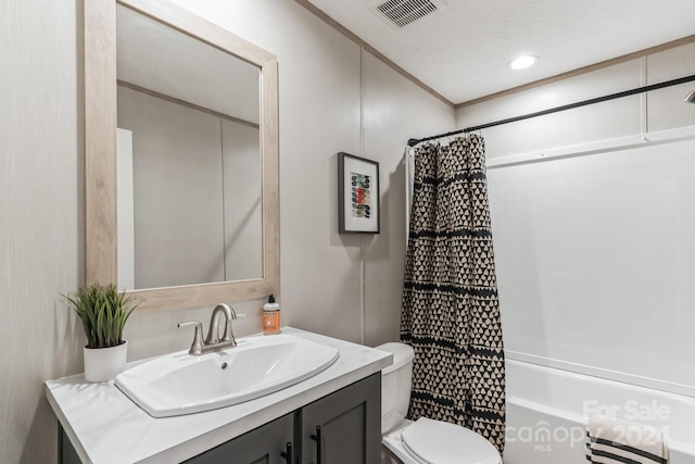 full bathroom with vanity, shower / bathtub combination with curtain, and toilet