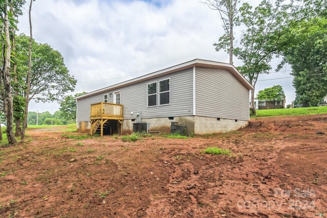 rear view of house with central AC