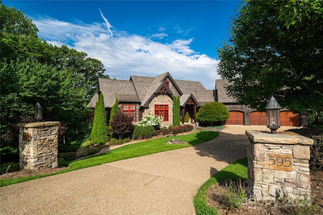 tudor house featuring a garage