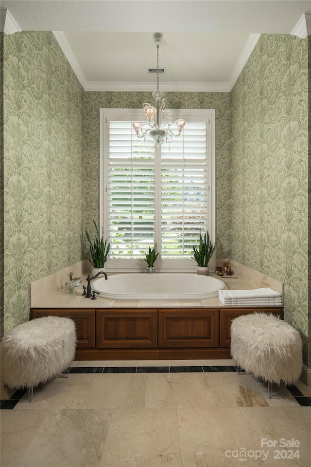 bathroom featuring crown molding, a chandelier, and a tub to relax in