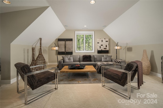 living room featuring vaulted ceiling