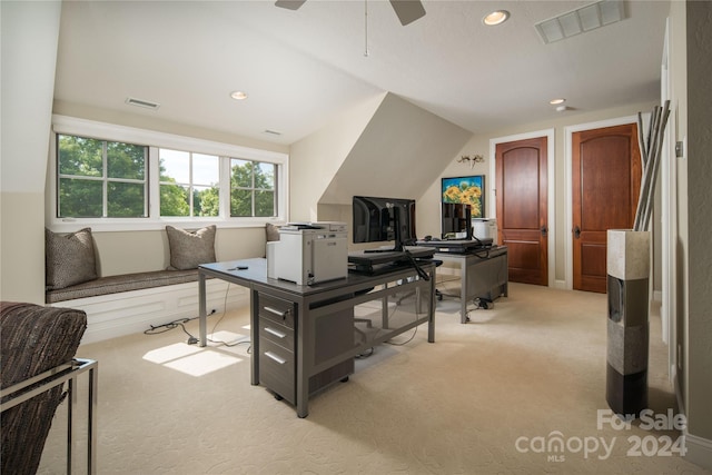 office featuring lofted ceiling and light carpet