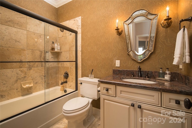 full bathroom featuring vanity, enclosed tub / shower combo, and toilet