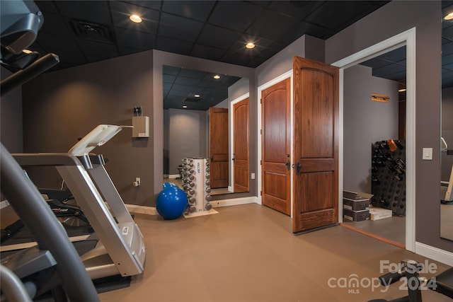 exercise area with a paneled ceiling