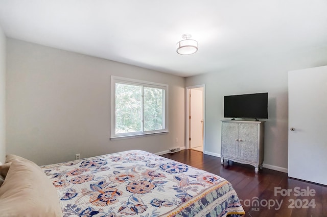 bedroom featuring dark hardwood / wood-style flooring