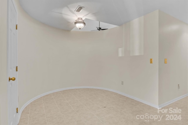 unfurnished room with visible vents, baseboards, and ceiling fan