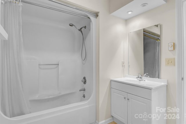 full bath with vanity and shower / bathtub combination with curtain