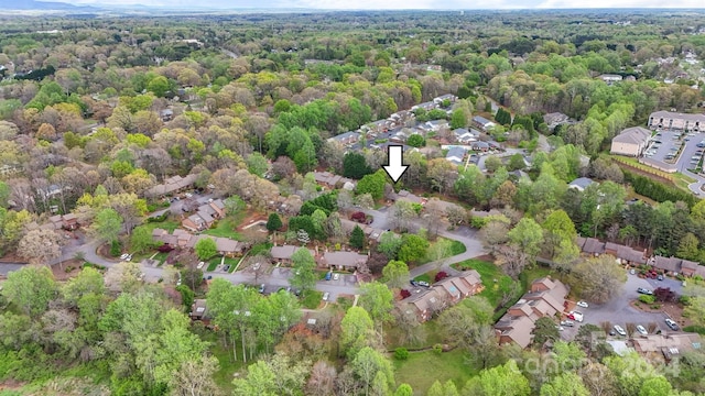 bird's eye view featuring a forest view and a residential view