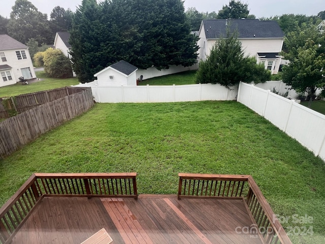 view of yard featuring a wooden deck