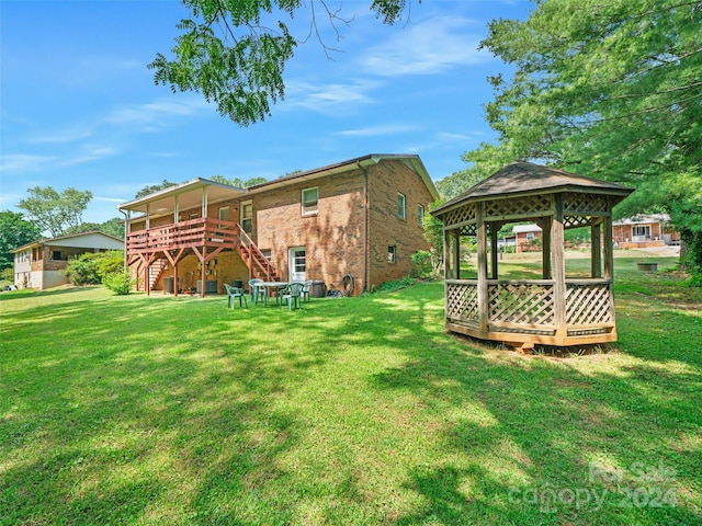 view of yard with a gazebo and a deck