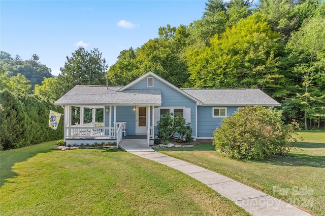 view of front of property with a porch and a front lawn