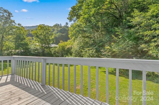 deck featuring a lawn