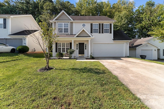 view of front of home with a garage, a front lawn, and a porch